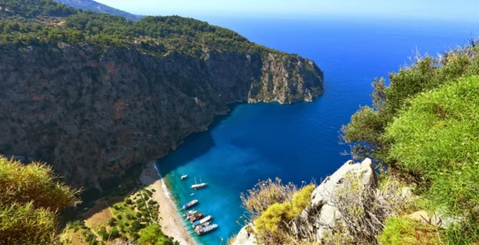 Hike up to the waterfall in Butterfly Valley