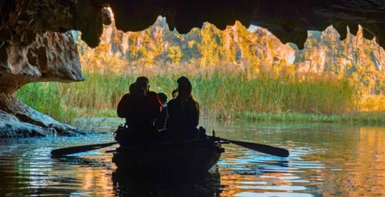 A ride in a traditional bamboo boat through the limestone caves